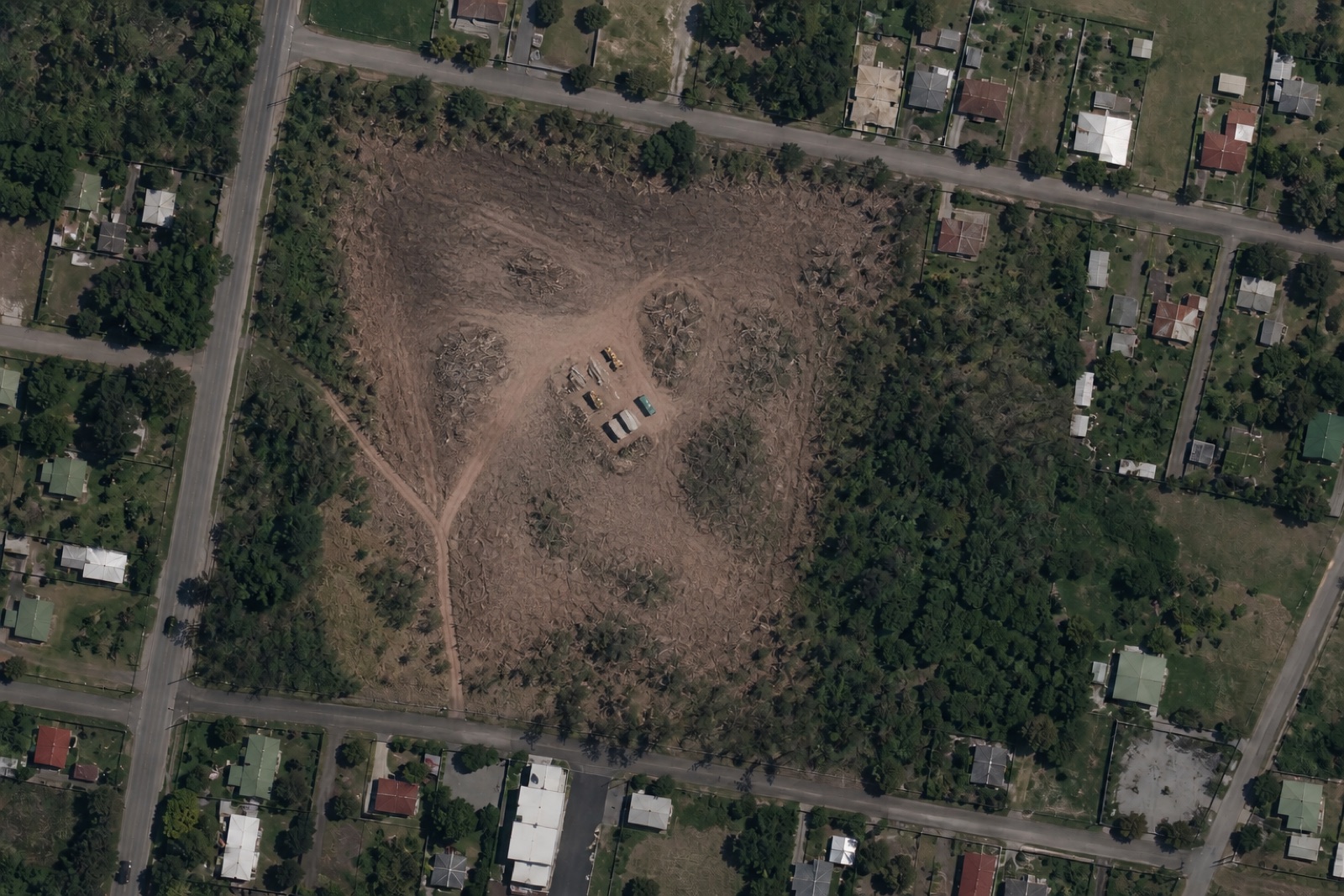 Illustrative current aerial view of the same peri-urban parcel after vegetation clearing and soil disturbance